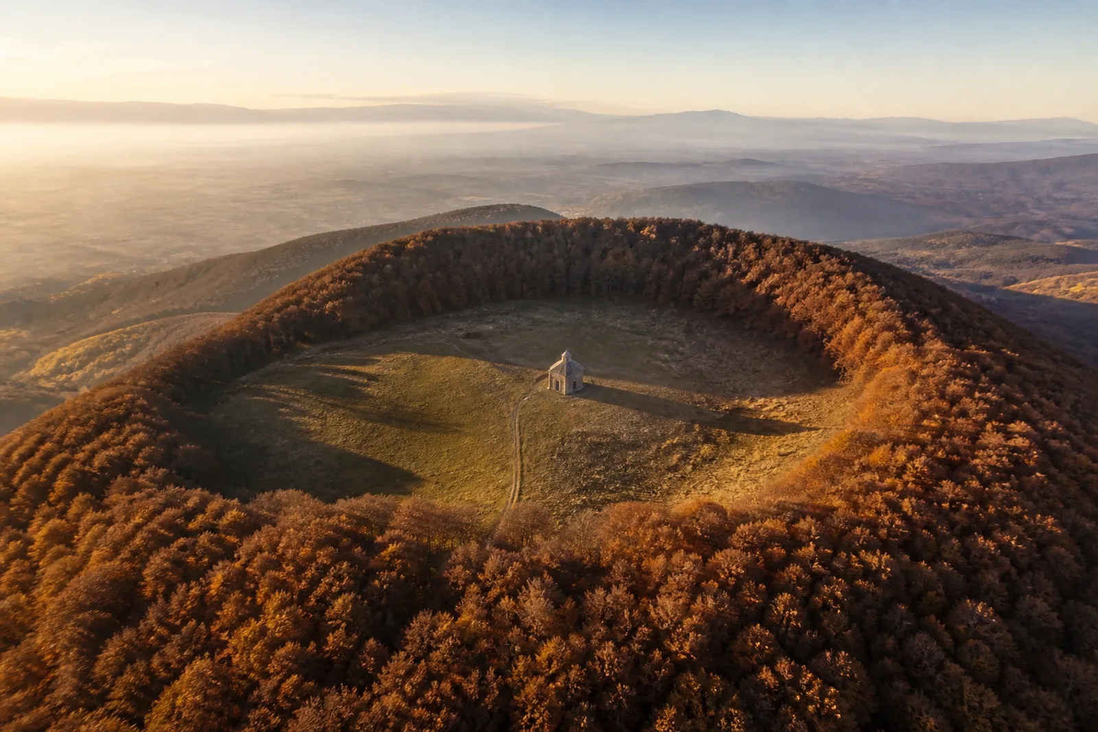 Santa Margarida crater from the air, with the Romanesque chapel at its centre